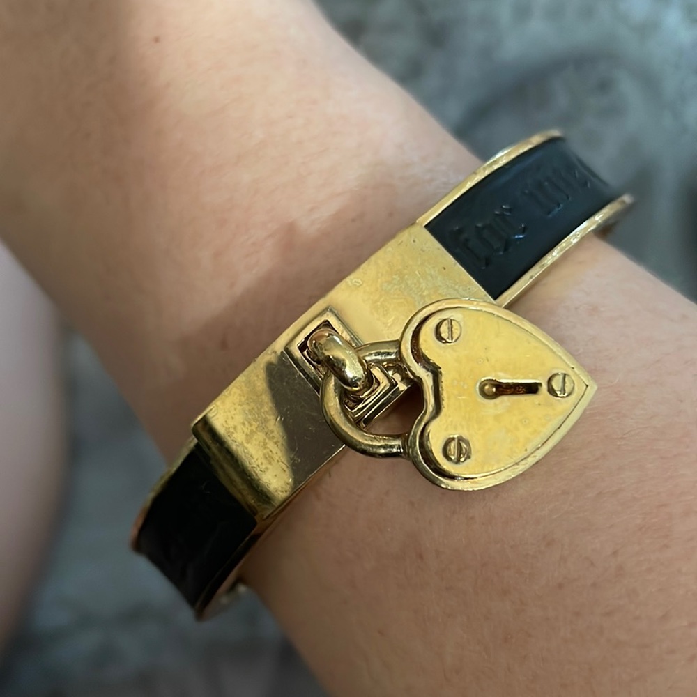 Black and gold juicy couture bangle with heart pendant
